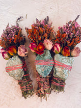 Load image into Gallery viewer, May include: Three bundles of dried flowers and herbs tied with twine and a green stone. The bundles are wrapped with pink string and include dried roses, lavender, and other flowers.