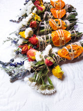 Load image into Gallery viewer, May include: A collection of dried flower and citrus bundles tied with twine. The bundles are made with dried flowers, citrus fruit, and herbs.