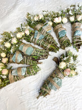 Load image into Gallery viewer, May include: A collection of dried flower bundles with green crystals tied with twine. The bundles are made with dried flowers, herbs, and green crystals.