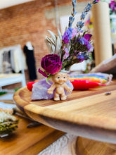 Load image into Gallery viewer, May include: A small plastic troll doll with a purple amethyst crystal and dried flowers on its head. The flowers include lavender, sage, and roses.
