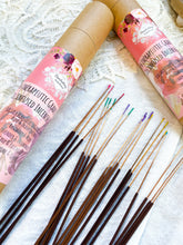 Load image into Gallery viewer, May include: A set of brown incense sticks with colorful tips, packaged in two cardboard tubes with floral designs. The tubes feature the text "Therapeutic Grade Oil Infused Incense" and "Charlielodge Herbal Boutique".
