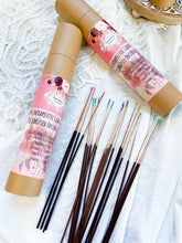 Load image into Gallery viewer, May include: Two brown cardboard tubes with pink labels containing 24 therapeutic grade oil infused incense sticks. The labels feature floral designs and the text "Therapeutic Grade Oil Infused Incense" and list the scents: Rose &amp; Frankincense, Rosemary, Lavender &amp; Sandalwood, Sage &amp; Patchouli, Jasm
