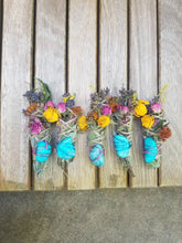 Load image into Gallery viewer, May include: Five bundles of dried sage wrapped in twine, each featuring a bright turquoise stone secured with pink wire. The bundles are decorated with dried flowers in shades of yellow, pink, purple, and orange, creating a colorful arrangement.
