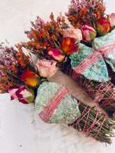 Load image into Gallery viewer, May include: Three bundles of dried herbs and flowers tied with pink twine and topped with a green stone. The bundles are wrapped in a green stone and tied with pink twine. The bundles are made with dried herbs and flowers, including roses.
