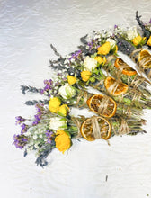 Load image into Gallery viewer, May include: A collection of dried flower bundles with dried orange slices, tied with twine. The bundles are made with lavender, white and yellow roses, and other dried flowers.
