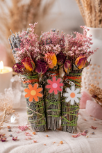 Load image into Gallery viewer, Lavender and mint floral bundles with retro daisy keychains styled with crystals and candlelight
